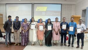 People holding their certificates